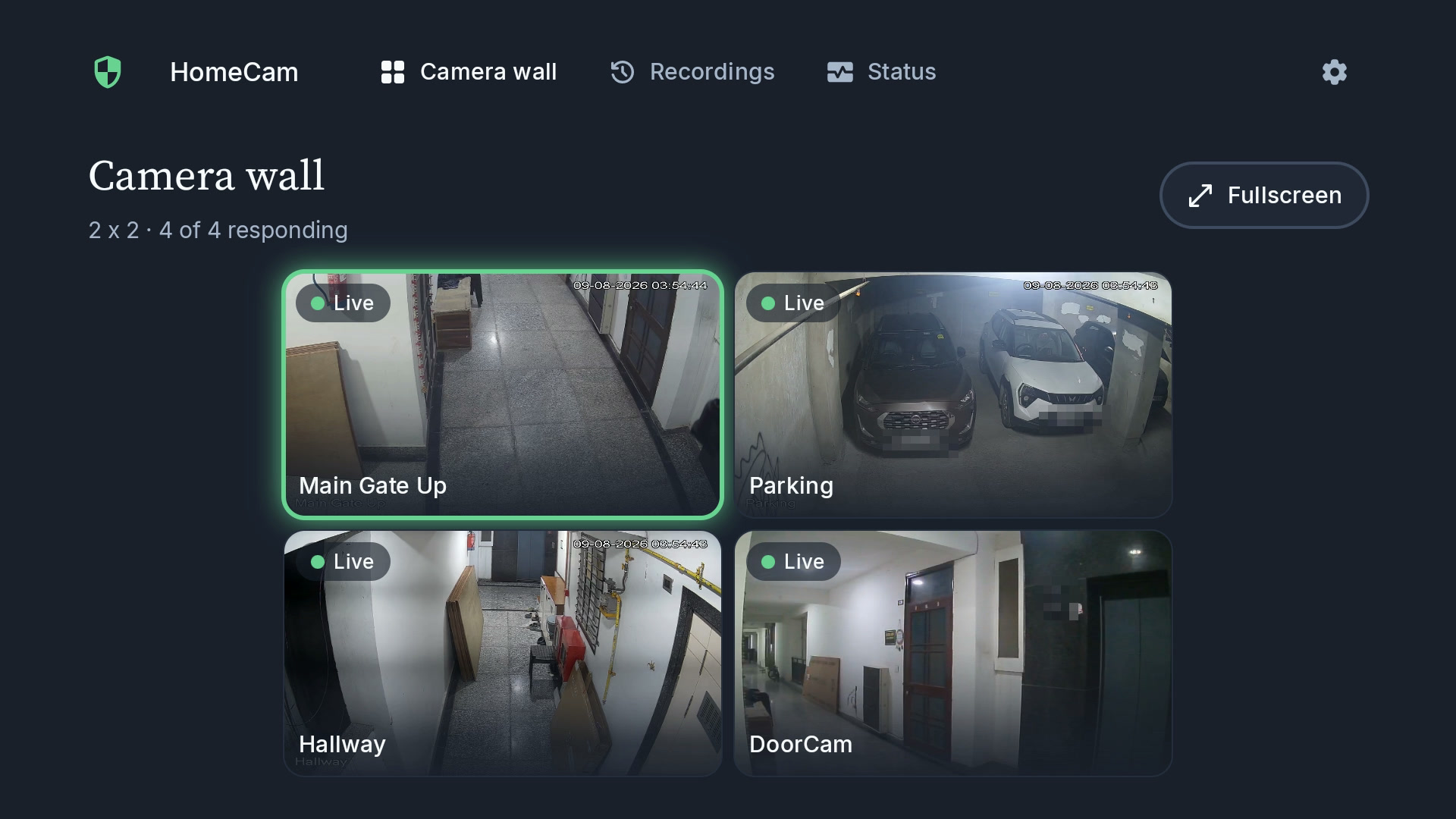 HomeCam TV camera wall showing four live cameras in a 2×2 grid